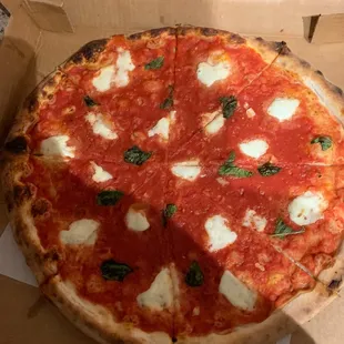 This was my 25 dollar margherita pizza. Almost all tomato sauce. Ridiculous