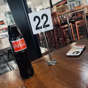 Enjoying a humongous Coke with your pizza really elevates the experience.