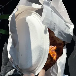 a person eating a slice of pizza