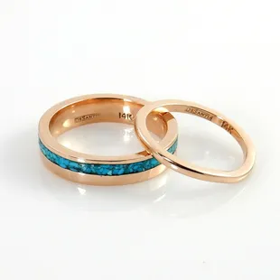 14kt rose gold turquoise chip inlay wedding band next to a 14kt rose gold contour wedding band