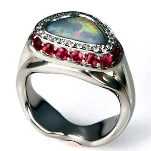 Amazing 14kt white gold diamond and ruby custom ring with lightning ridge opal set in the center