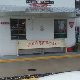 a bench in front of a restaurant