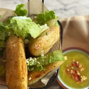 2 vegan chorizo and a chicken empanada , salsa is