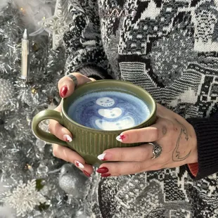 a woman holding a mug of hot chocolate