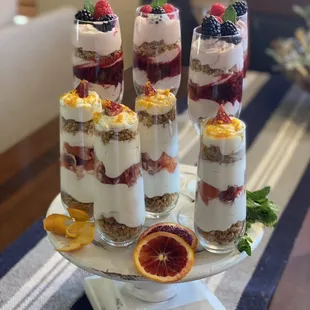 Yogurt parfaits. Vanilla yogurt layered with blood orange granola and topped with mint and honey drizzle.