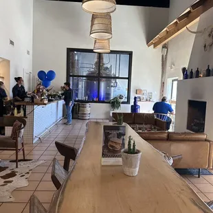Live edge tables, fireplace, &amp; bar