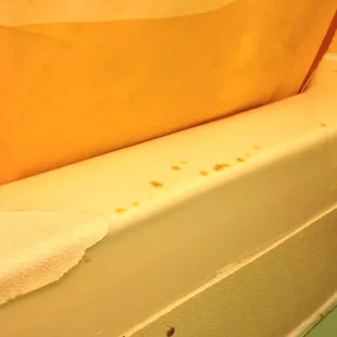 Cigarette burns on tub in non smoking room.