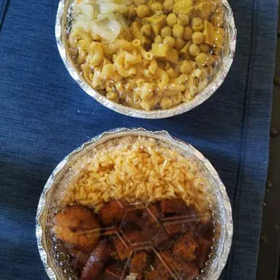 Curry chickpeas and tofu with mac and cheese and cabbage, and jerk bbq tofu with yellow rice and plantains