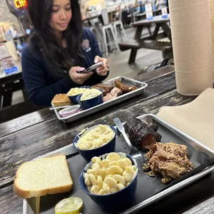 a woman sitting at a picnic table