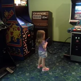 Cute little arcade with pac-man, zombie shootout and a  prize crane.