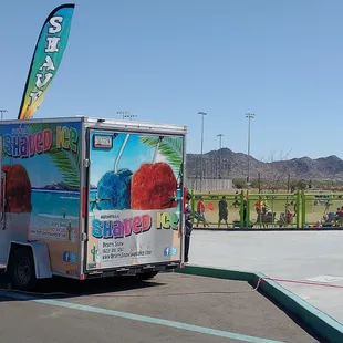 an ice cream truck parked in a parking lot