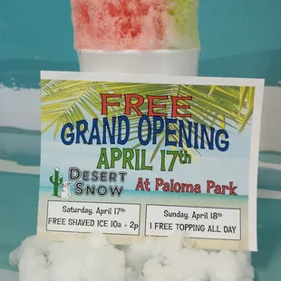 a sign for the grand opening