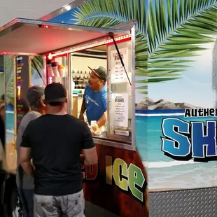a group of people standing in front of a food truck