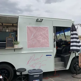 a man standing in front of a food truck