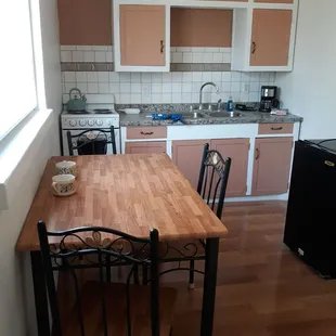 Unit with kitchen area showing preserved cabinetry.