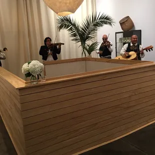 Mariachi players around an opening to lower level . I hope to see the entire store on my next visit .