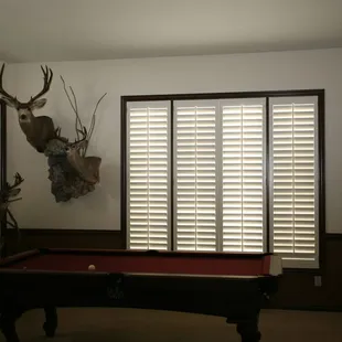 White shutter panels with stained framing.