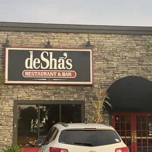 a car parked in front of the restaurant