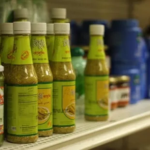a row of bottles of condiments