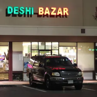 a car parked in front of a store