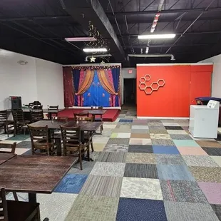 an empty restaurant with tables and chairs