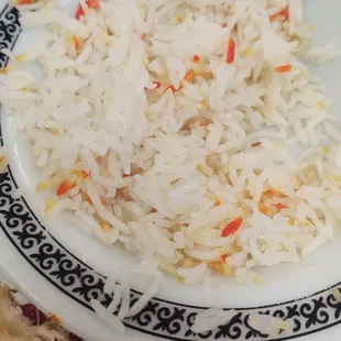 a plate of rice and meat