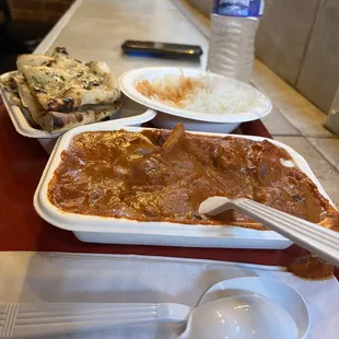 Chicken tikka masala with garlic naan and 2 water bottles $19