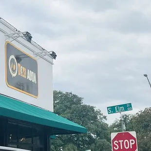 a stop sign in front of a restaurant