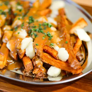 a plate of french fries with gravy