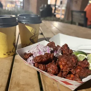 a basket of food and a cup of coffee
