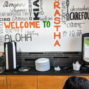 They should consider moving the trash bin away from fresh plates and cups