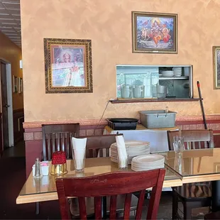 a dining area with tables and chairs