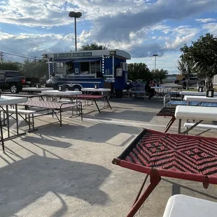 tables and chairs in a parking lot