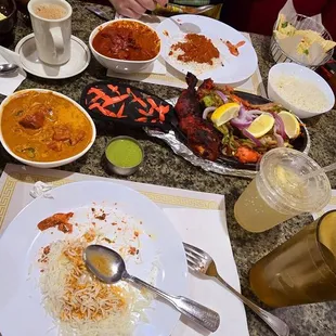 Paneer Naan, Lemon soda, Chai drink, Butter Chicken curry with rice, Chicken Tikka masala curry and goat curry. High and low spice levels