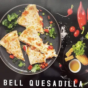 Bell Quesdilla come with onions and jalapeños with our in house BELL SAUCE.