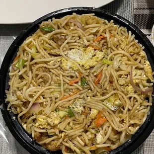 a plate of noodles and vegetables