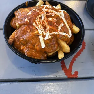 Poutine- butter chicken with fries