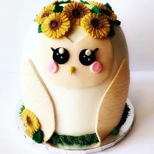 ws a white owl with sunflowers on its head