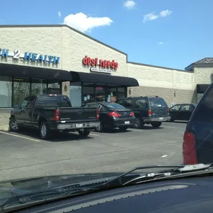 cars parked in front of a restaurant