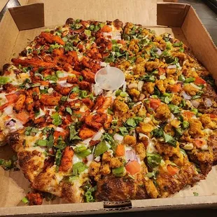 Large half tandoori chicken and half curry chicken.