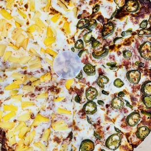 Half cheese and pineapple and half cheese and jalapeños!! Pizza was full of flavor kids enjoyed it very much too!Best pizza