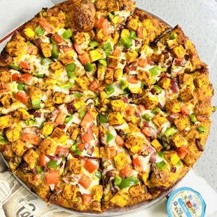 a whole pizza on a platter