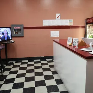 a counter with a laptop on it