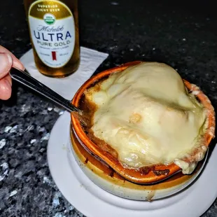 a plate of food and a bottle of beer