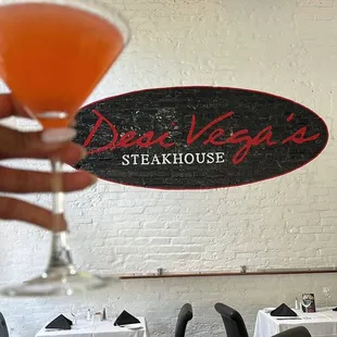 a person holding a glass of wine