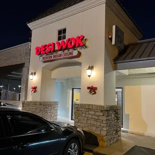 a car parked in front of a restaurant