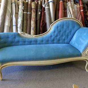 French tufting back on an upholstered antique chaise lounge