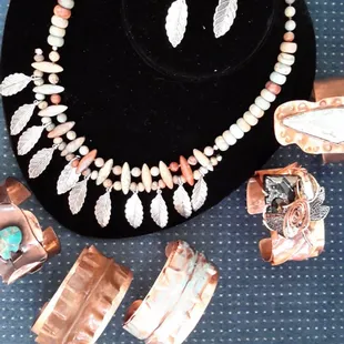 Variety of Copper Cuffs and Bracelets with African Opal Necklace