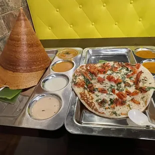 Pushapa Dosa on the left and Tomato Uttappam on the right.