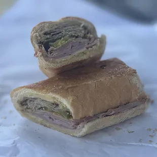 16) Cuban Sandwich: Ham, Roast Pork, Swiss Cheese, Butter, Mustard, Pickles - $9 (8")